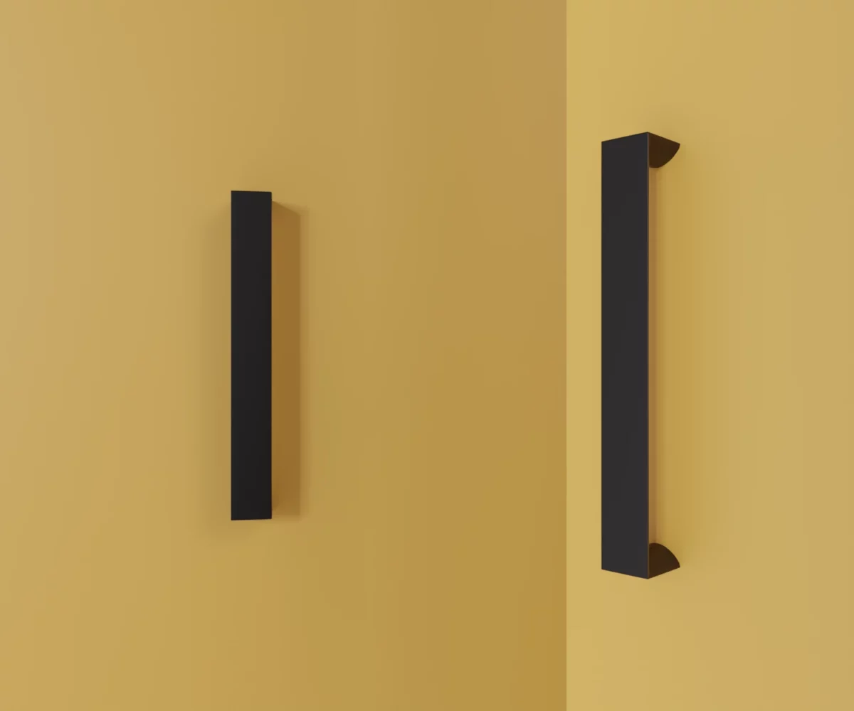 Zwei mattschwarze Zink-Möbelgriffe vom Typ HA-ZI-11024 vor gelbem Hintergrund: links in Frontalansicht, rechts in Dreiviertelansicht.