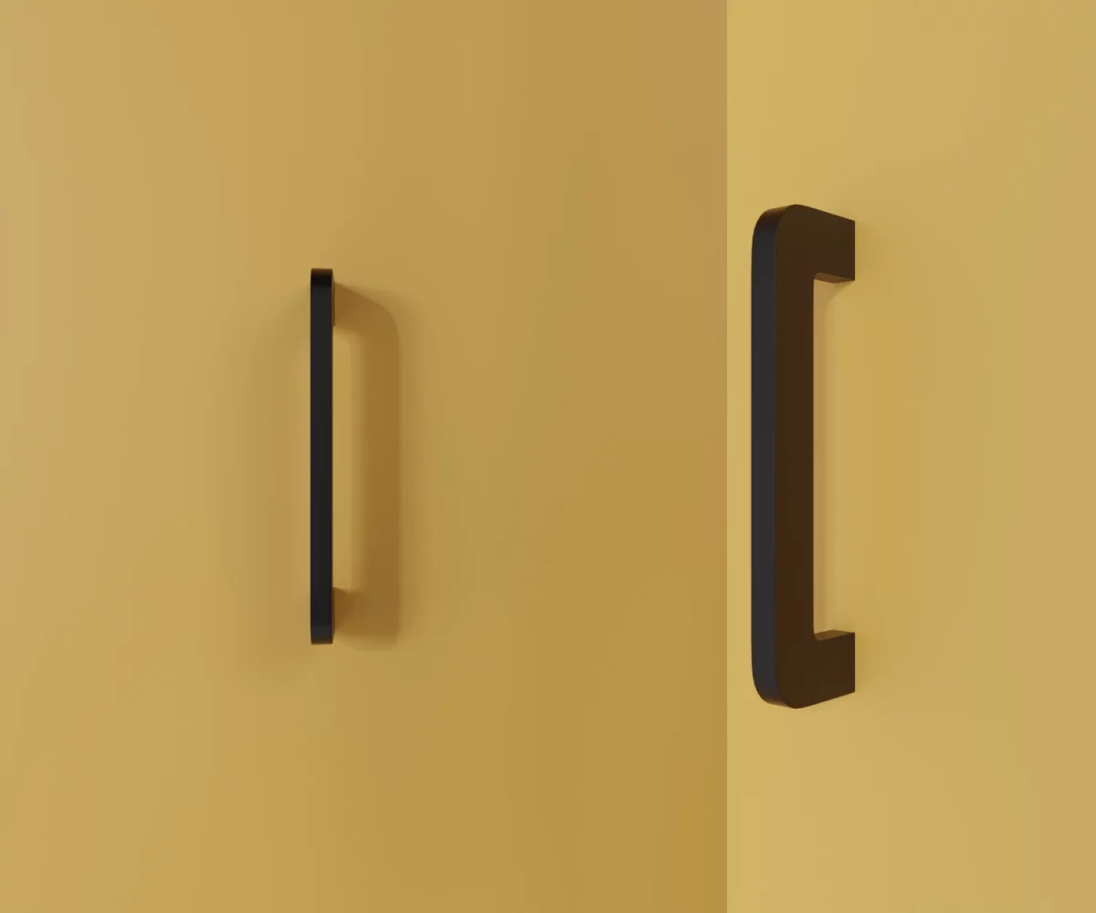 Zwei mattschwarze Zink-Möbelgriffe vom Typ HA-ZI-11077 vor gelbem Hintergrund: links in Frontalansicht, rechts in Dreiviertelansicht.