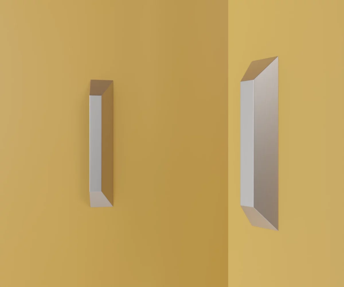 Zwei silberne Zink-Möbelgriffe vom Typ HA-ZI-17002 vor gelbem Hintergrund: links in Frontalansicht, rechts in Dreiviertelansicht.