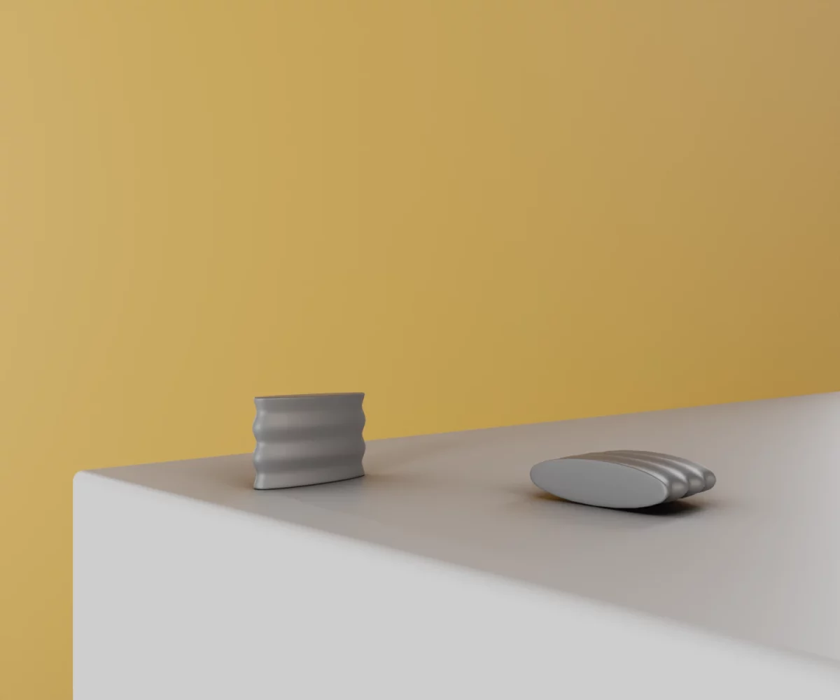 Zwei silberne Zink-Knäufe vom Typ KB-ZI-11029 auf einer weißen Fläche vor gelbem Hintergrund.