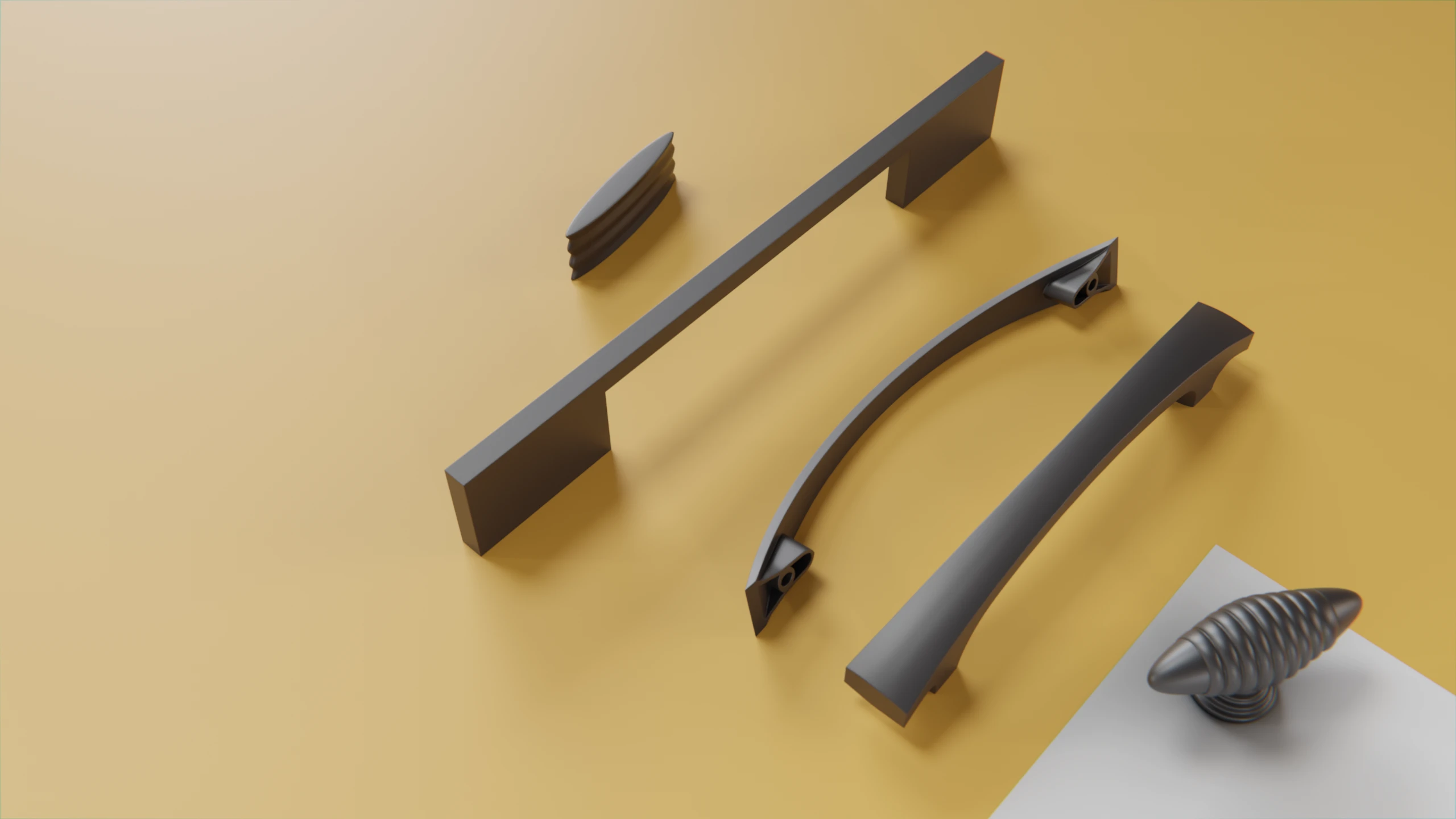 Eine Ansammlung von 3 Möbelgriffen und 2 Knäufen aus Zink auf gelben Hintergrund.