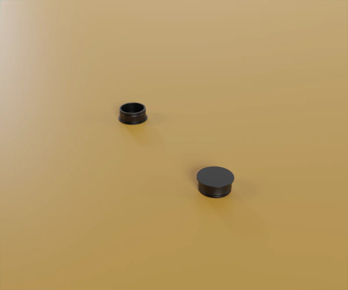 Zwei edge-Zubehörteile vom Typ FC-KF-15025 auf einem gelben Hintergrund. Hierbei handelt es sich um Kunststoffstopfen um ein Schraubloch in einem edge-profil abzuschließen.