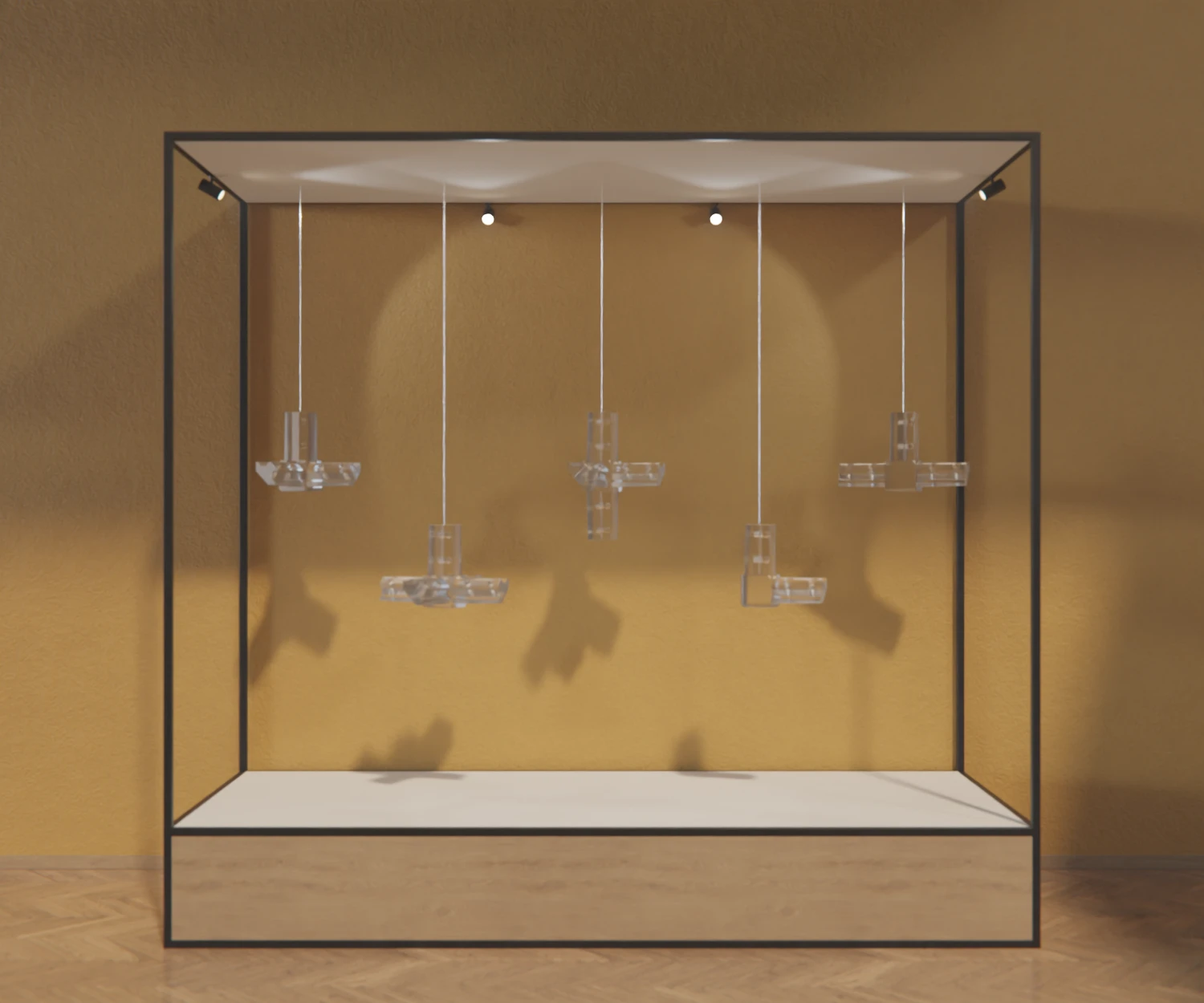 Ein rechteckiges Rahmengestell, zusammengestellt aus dem Edge-System, mit schwarzen Verbindern und Profilen, auf einem Parkettboden vor einer gelben Wand. Von der Decke hängen 5 unterschiedliche EdgePlus Verbinder aus Acryl.